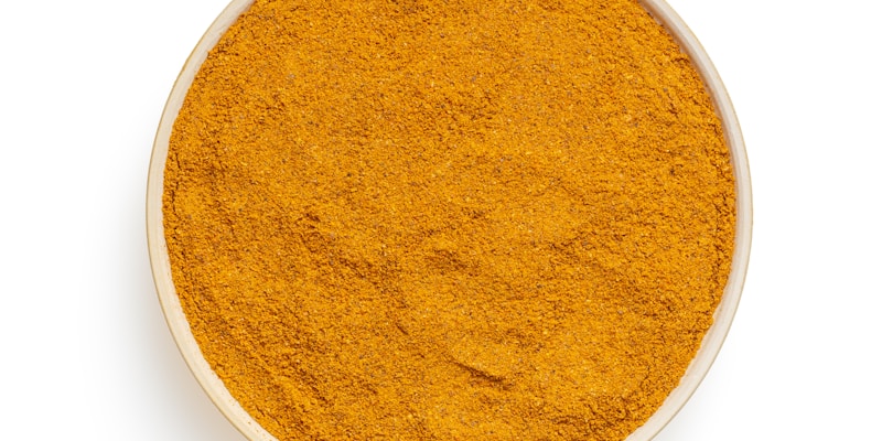 Turmeric root and curcumin powder representing bioavailability research