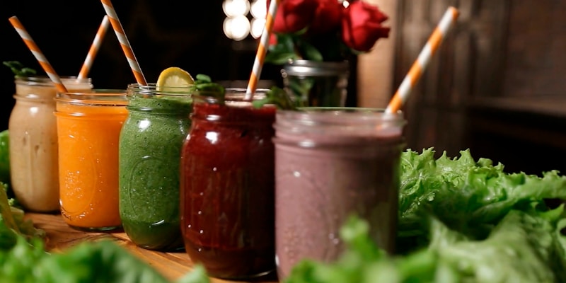 Green smoothie and supplement powder representing AG1 greens powder